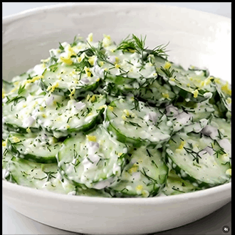 A crisp sliced cucumber salad tossed in a bright lemon dressing and garnished with fresh dill